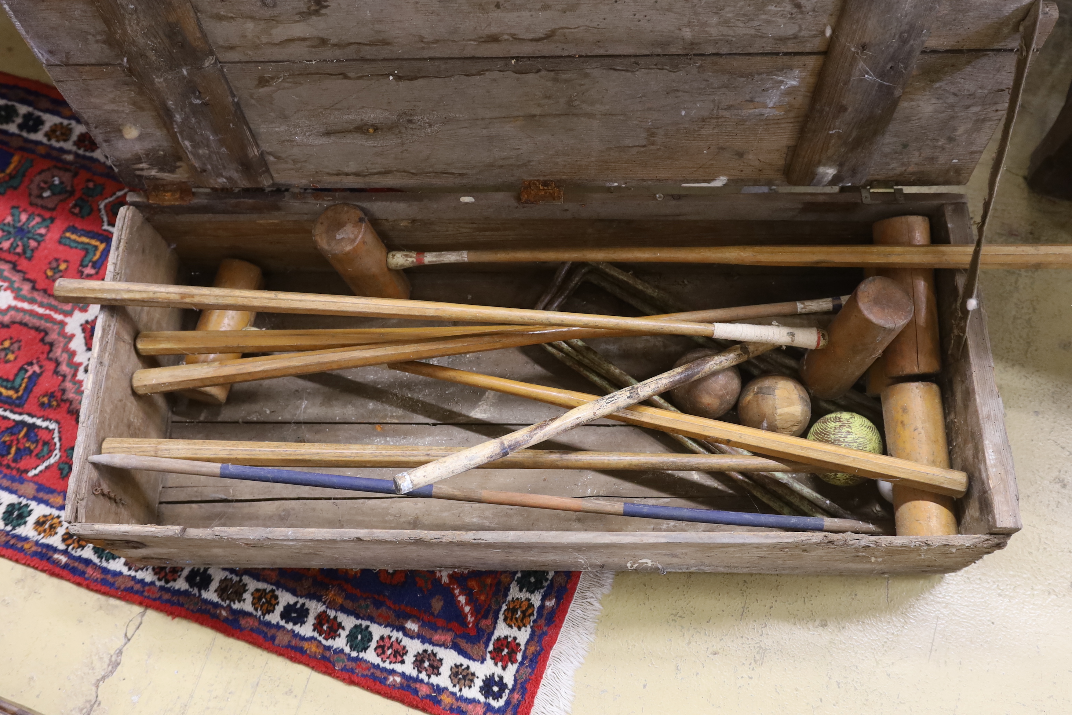 A vintage pine cased croquet set